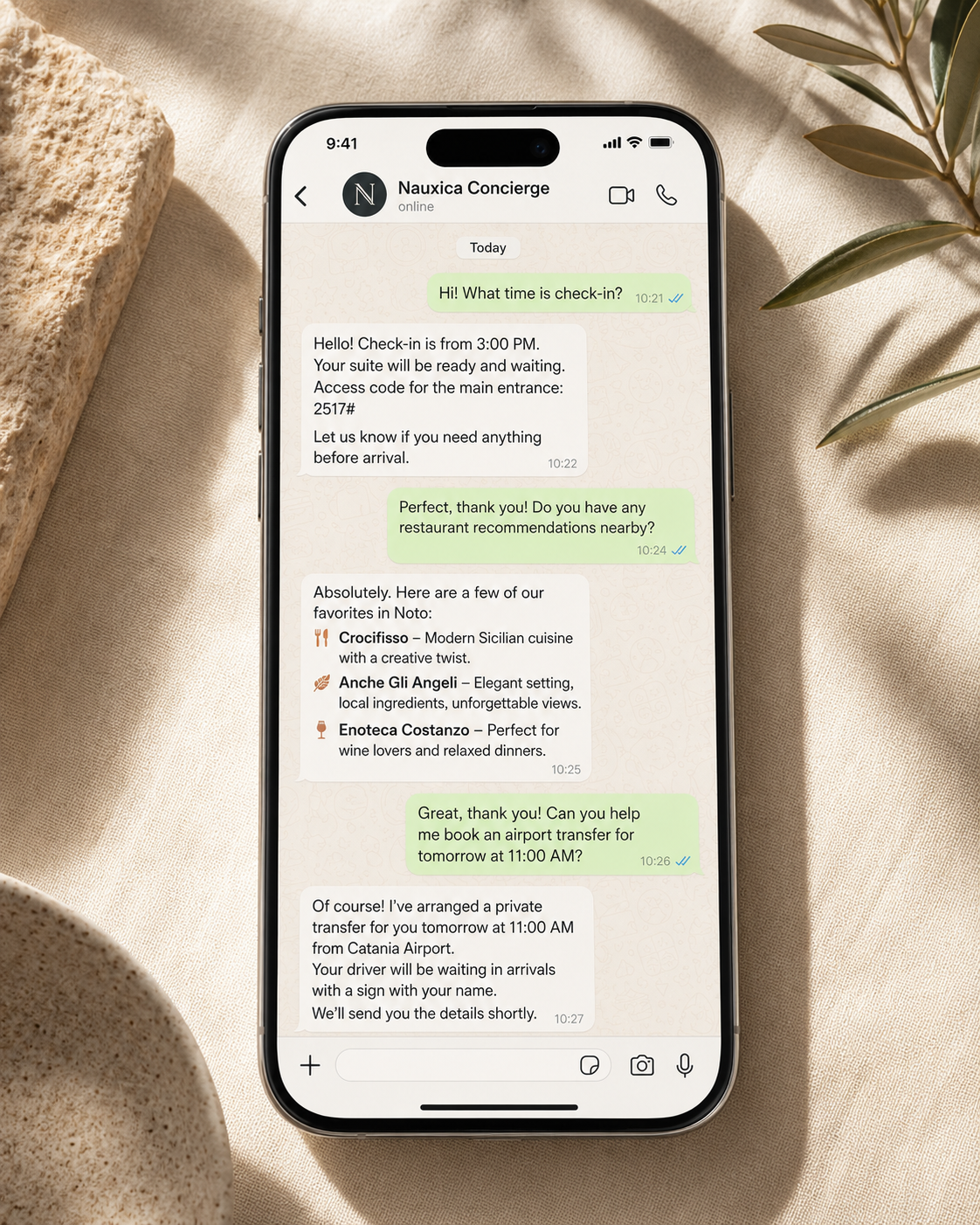 Nauxica WhatsApp AI concierge on a smartphone